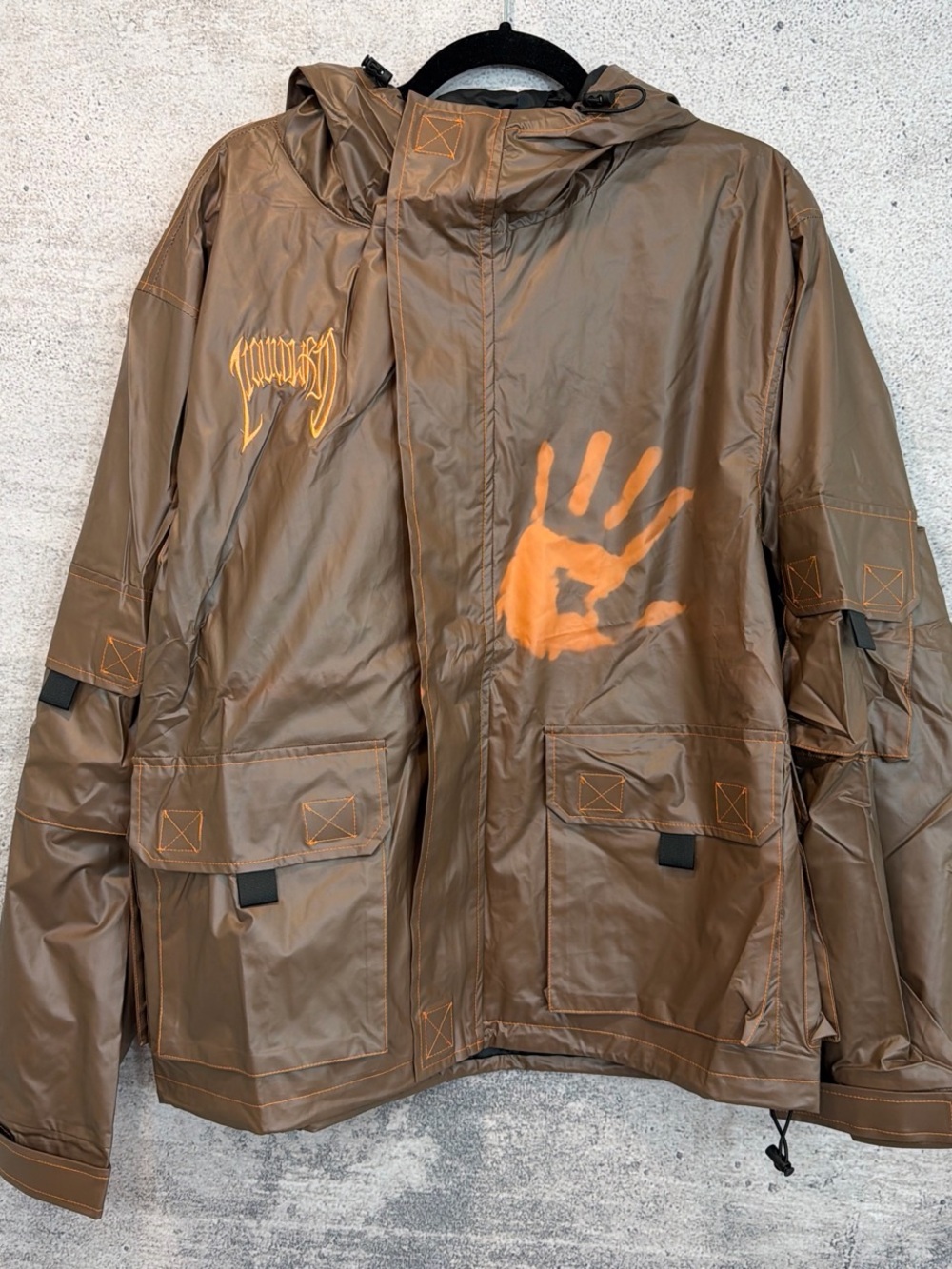 NWOT men’s Brown Hooded COLORSHIFTING rainJacket - changes color W temperature!